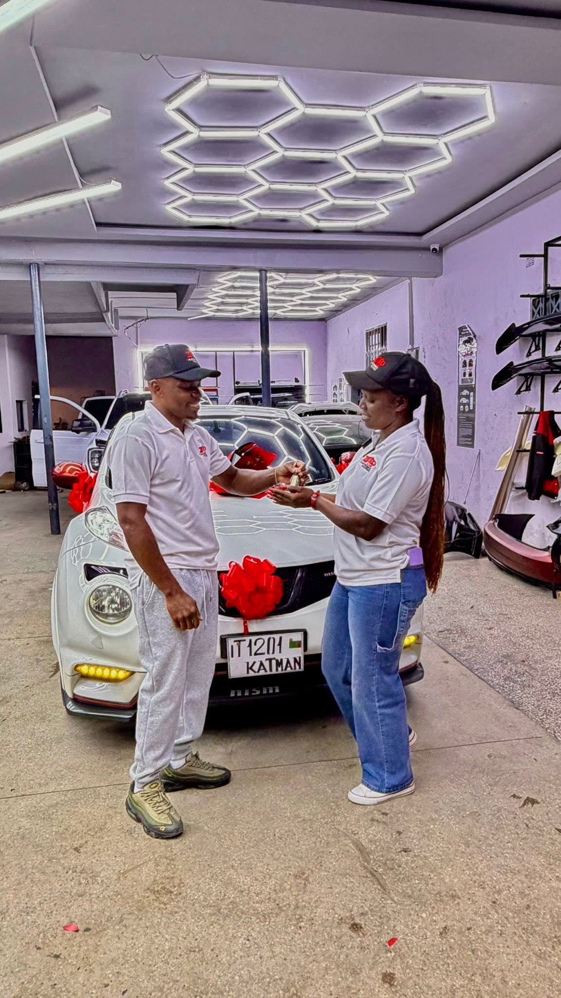 ZED Car Electronics team handing over a customer's finished car